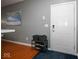 Home entryway featuring shoe storage, wall art, and a white entry door at 1623 N College Ave # 2, Indianapolis, IN 46202