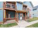Exterior view featuring balconies, patios, and covered entryways at 1623 N College Ave # 2, Indianapolis, IN 46202
