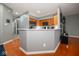 Bright kitchen with stainless steel appliances and a white countertop breakfast bar at 1623 N College Ave # 2, Indianapolis, IN 46202