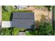An aerial view of a modern home featuring a dark gray roof, clean lines, and a well-maintained yard at 2689 Pearl St, Columbus, IN 47201