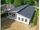 Rear view of modern home featuring a patio, large windows, and sleek roofline at 2689 Pearl St, Columbus, IN 47201
