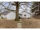 Cozy home with a backyard featuring a patio, grill, and mature trees at 3000 Pearl St, Anderson, IN 46016