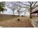 Backyard featuring a fire pit and mature trees at 3000 Pearl St, Anderson, IN 46016