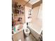 Classic bathroom featuring a shower-tub combo, sink, and neutral tones, offering functionality at 3000 Pearl St, Anderson, IN 46016