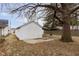 Garage featuring a concrete patio and a well-maintained yard at 3000 Pearl St, Anderson, IN 46016