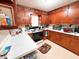 Kitchen featuring wooden cabinets and white countertops at 3000 Pearl St, Anderson, IN 46016