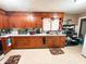Kitchen with wooden cabinets and tile floors at 3000 Pearl St, Anderson, IN 46016