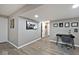 Finished basement area featuring laminate flooring, a cozy desk space, and neutral paint tones for a modern feel at 3258 Cherokee Cir, Bargersville, IN 46106