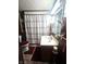 Bathroom featuring a toilet, sink, mirror and shower with white shower curtain at 3624 Columbus Ave, Anderson, IN 46013