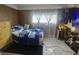 Bedroom featuring a window with natural light, bed, dresser, and ample closet space at 3624 Columbus Ave, Anderson, IN 46013