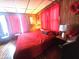 Inviting bedroom with red accents and decor, creating a warm and comfortable retreat space at 3624 Columbus Ave, Anderson, IN 46013