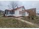 Charming house featuring a cozy front porch and a red trim, adding a touch of character to the property at 3624 Columbus Ave, Anderson, IN 46013