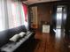 Living room area featuring hardwood floors, a couch, and stylish decor, creating a welcoming atmosphere at 3624 Columbus Ave, Anderson, IN 46013