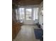 Sunroom with view to the back yard featuring a hutch, chair, and rug at 3624 Columbus Ave, Anderson, IN 46013