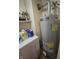 Utility room with water heater, washing machine and storage space at 3624 Columbus Ave, Anderson, IN 46013