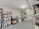 Unfinished basement area featuring storage shelving, laundry area with washer and dryer, and mechanical equipment at 3659 Watson Rd, Indianapolis, IN 46205