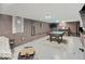 Spacious basement with brick walls, a pool table, and a bar area for entertaining at 3659 Watson Rd, Indianapolis, IN 46205