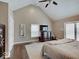 Vaulted ceiling bedroom with warm colors, a ceiling fan, and a large closet at 3659 Watson Rd, Indianapolis, IN 46205