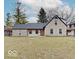 Charming single-story home with stone facade, dark roof, and a bright orange front door at 3659 Watson Rd, Indianapolis, IN 46205