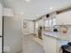 Well-lit kitchen with stainless steel appliances, granite countertops, and ample cabinet space at 3659 Watson Rd, Indianapolis, IN 46205