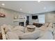 Living room with neutral walls, white fireplace and a comfortable sectional sofa at 3659 Watson Rd, Indianapolis, IN 46205