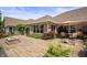 Well-maintained backyard featuring a patio, lush plants, and outdoor seating at 4857 W Congress Cv, New Palestine, IN 46163