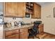 Well-organized home office with custom cabinets, a desk with a marble-style top and a comfortable office chair at 4857 W Congress Cv, New Palestine, IN 46163