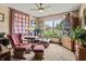 Cozy living room with comfortable seating, a large window, and a decorative quilt hanging on the wall at 4857 W Congress Cv, New Palestine, IN 46163