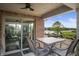 Outdoor patio with stone table and chairs overlooking a pond at 4857 W Congress Cv, New Palestine, IN 46163