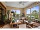 Cozy sunroom with lots of natural light, comfortable seating, and tranquil views of the yard at 4857 W Congress Cv, New Palestine, IN 46163