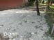 Gravel area with a chair and fenced perimeter, perfect for outdoor relaxation or extra storage at 5206 E St Clair St, Indianapolis, IN 46219