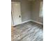 Well-lit bedroom with fresh paint, flooring, and window, offering a cozy and inviting atmosphere at 5206 E St Clair St, Indianapolis, IN 46219