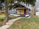 Charming home with a blue exterior, wood siding, and well-manicured lawn at 5206 E St Clair St, Indianapolis, IN 46219