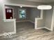 Spacious living room with open layout, recessed lighting, and stylish flooring, creating an inviting ambiance at 5206 E St Clair St, Indianapolis, IN 46219