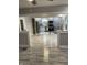 Open-concept living area with kitchen view, modern appliances, and stylish floors at 5206 E St Clair St, Indianapolis, IN 46219