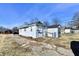 Back exterior view of home with a shed, showing the backyard space and access at 613 S Mickley Ave, Indianapolis, IN 46241