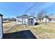 Backyard view showcasing a storage shed, perfect for outdoor equipment and tools at 613 S Mickley Ave, Indianapolis, IN 46241