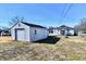 Backyard features a detached garage, providing parking and storage solutions at 613 S Mickley Ave, Indianapolis, IN 46241