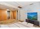 Bedroom featuring virtual staging with a large screen TV at 613 S Mickley Ave, Indianapolis, IN 46241