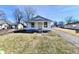 Charming single-story home with a cozy front porch and driveway at 613 S Mickley Ave, Indianapolis, IN 46241
