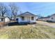 Charming single-story home with a cozy front porch and driveway at 613 S Mickley Ave, Indianapolis, IN 46241