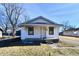 Charming single story home with a small front porch and neat landscaping at 613 S Mickley Ave, Indianapolis, IN 46241