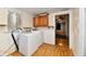 Laundry room featuring washer, dryer, and cabinets, awaiting your personal touch for renovation at 613 S Mickley Ave, Indianapolis, IN 46241