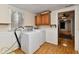 Laundry room featuring washer, dryer, and cabinets, awaiting your personal touch for renovation at 613 S Mickley Ave, Indianapolis, IN 46241
