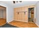 View of an empty room with wood paneling and linoleum floors at 613 S Mickley Ave, Indianapolis, IN 46241