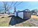 Dual backyard shed with weathered wood and white siding for extra storage at 613 S Mickley Ave, Indianapolis, IN 46241