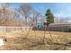 Large backyard with a swing set and chain link fence at 6404 W Ray St, Indianapolis, IN 46241