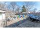 Fenced backyard featuring a small wooden deck, play set, and plenty of room for entertaining at 6404 W Ray St, Indianapolis, IN 46241