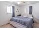 Neutral bedroom with a large bed, soft gray bedding, and ample natural light at 6404 W Ray St, Indianapolis, IN 46241