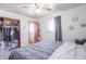 Bedroom featuring a neutral color scheme, with closet storage, and window views at 6404 W Ray St, Indianapolis, IN 46241